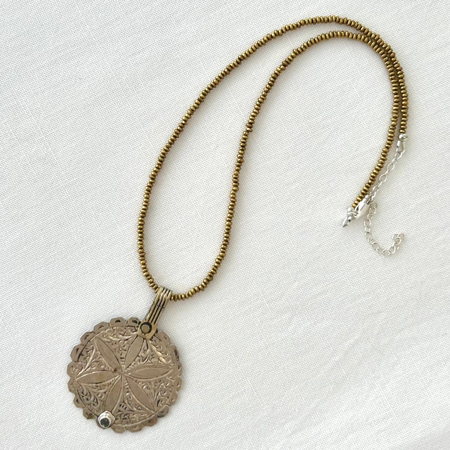 Brass necklace with large antique Moroccan silver flower pendant