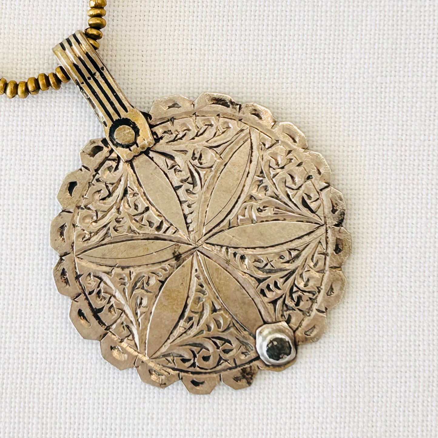 Brass necklace with large antique Moroccan silver flower pendant